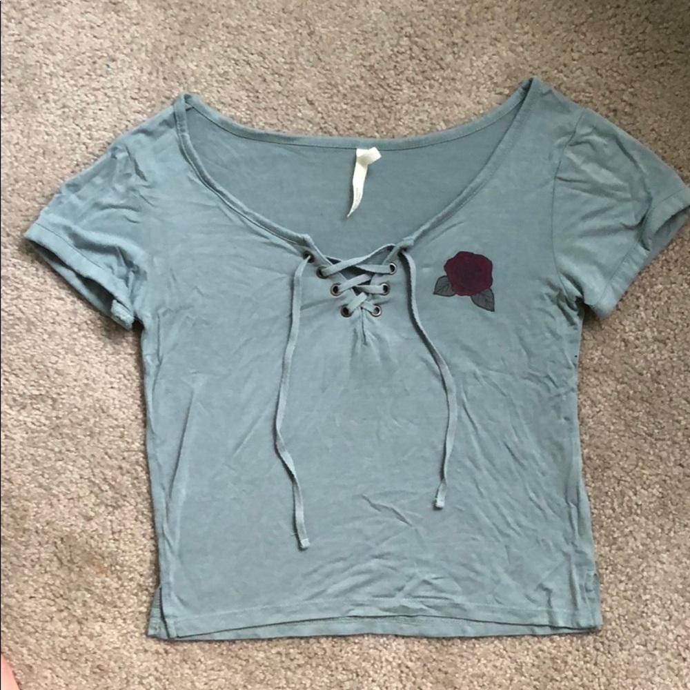 Teal shirt with red rose